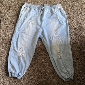 Blue ripped denim joggers